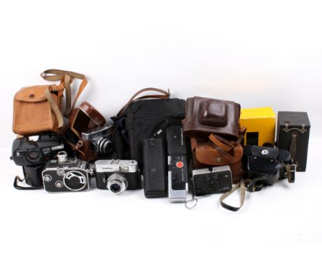 A collection of assorted vintage film cameras. Including Kadak Instamatic 133 in original box, a Paillard - Bolex cine camera