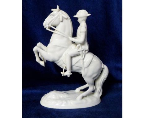 Collectables, white glazed ceramic model of a Spanish Riding School Lipitzana horse with rider performing a Levade.  Height a