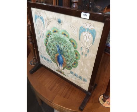 A picture fire screen with needlework of a peacockCondition: General surface wear with age with no major damage or repair.