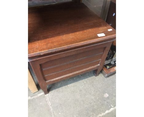 A mahogany commode with ceramic pot. 