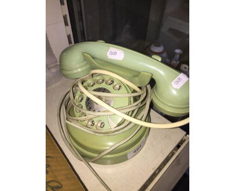 Vintage light green circular telephone 