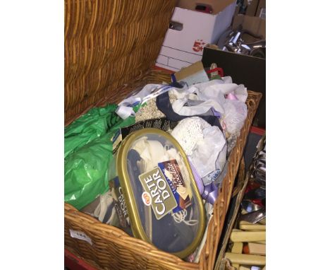 A wicker hamper with haberdashery items 