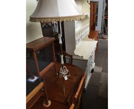 An onyx effect and brass standard lamp 