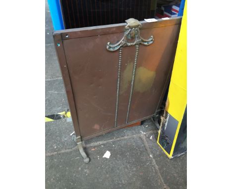 A brass fire screen 