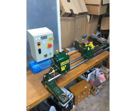 A Record Power CL3 36 Wood Turning Lathe Incl a box of attachmentsDimensions of bench only:-Length - 209cmWidth - 49cmHeight 