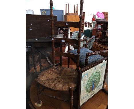 A rush seated ladder back chair 