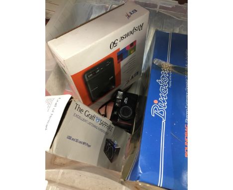 Box containing camera, answering machine and 2 speaker systems 