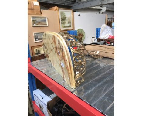 A gilt metal and marble wall shelf. 