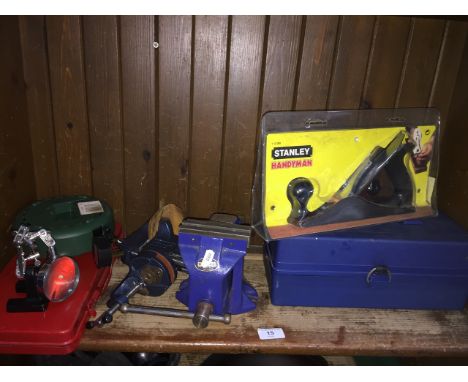 A lot of tools to include mini vices, etc. 