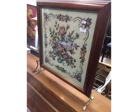 A woven picture fire screen 