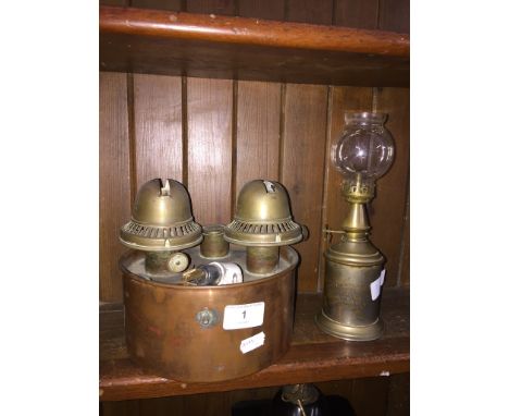 A copper based heater and a metal handheld lamp with glass shade. 