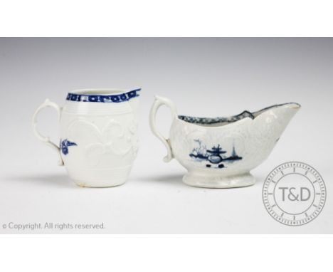 An 18th century Worcester porcelain robin's beak jug, circa 1775, the barrel shaped jug moulded with scrolls and printed in b