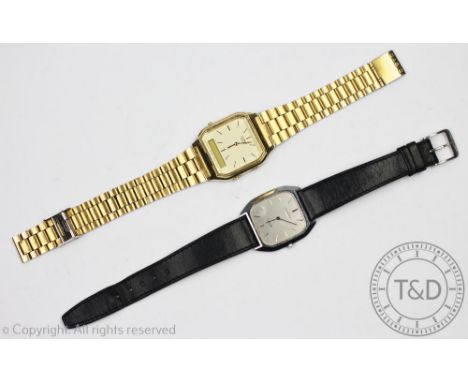 A gentlemans Longines Quartz wristwatch, the stainless steel case enclosing a cushion shaped, silvered dial with batons, case