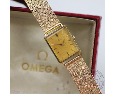 A 18ct gold Omega wristwatch, the rectangular case enclosing gilt face with batons, inner case stamped 'Omega Watch Co, 115, 