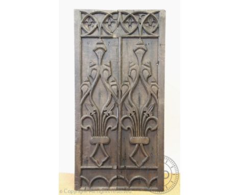 A 19th century carved oak panel, worked with angular foliate detailing, (split and braced from the back), 122cm H x60.5cm W