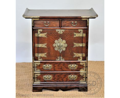 A modern Chinese burr wood low cabinet, with four drawers and two cupboard doors, 64cm H x 59cm W x 36cm D CONDITION REPORT: 