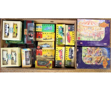 A collection of thirteen Vanguards die cast model vehicles, all boxed, with seven Maisto die cast Classic Christmas Ornaments