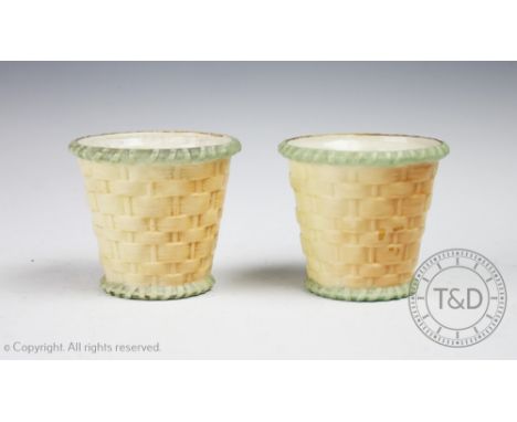 A pair of Royal Worcester porcelain Blush Ivory Cache Pots, shape G.857, date code for 1906, RdNo.302678, each with ozier mou