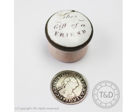 A late 18th century enamelled circular pill or patch box, titled to the cover 'A gift of a friend' 2.1cm diameter enclosing a