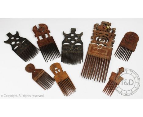 A collection of eight West African tribal art carved wood hair combes, the smallest with a finial carved as a head, 17.5cm, t