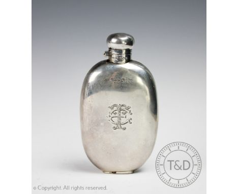 A silver hip flask, 'J M &amp; S' Sheffield 1911, of oval form with concave back and bayonet top, initialled 'ET', gross weig