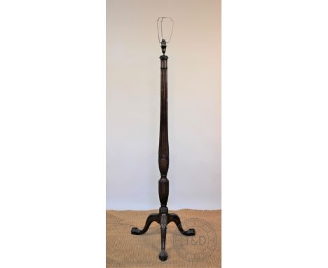 An Edwardian carved mahogany standard lamp, with fluted column, on tripod base with claw and ball feet, 156cm H CONDITION REP