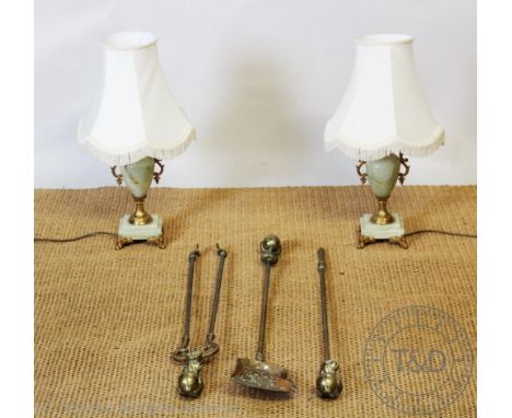 A Victorian style brass three piece companion set, with claw and ball terminals, poker 89cm, with a pair of onyx table lamps 