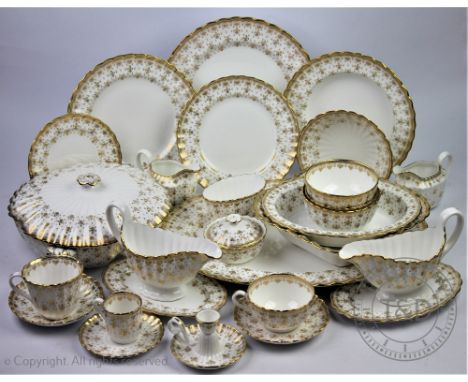 An extensive Spode fleur de lys dinner, tea and coffee service, comprising; twenty two dinner dinner plates, 27.5cm diameter,