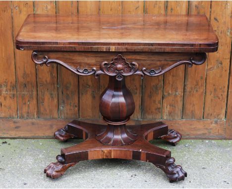 A William IV rosewood card table, with column on a circular platform and paw feet 75cm H x 91cm W x 45cm D