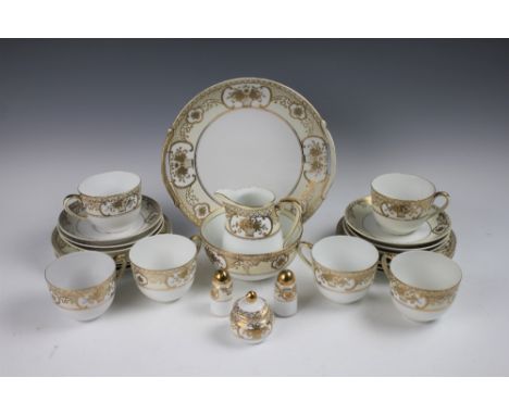 A Japanese Noritake tea service comprising; six teacups and saucers, six plates, a serving plate, slop bowl, milk jug, salt, 