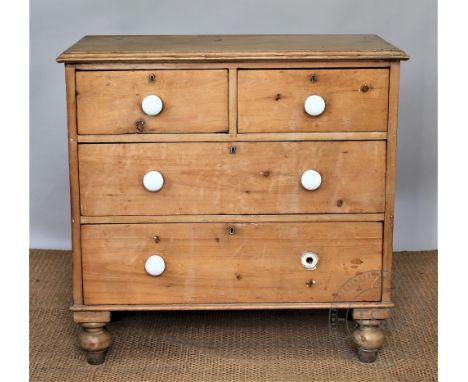 A late Victorian pine chest, of two short and two long drawers, with ceramic handles, on turned feet, 87cm H x 90cm W x 47cm 
