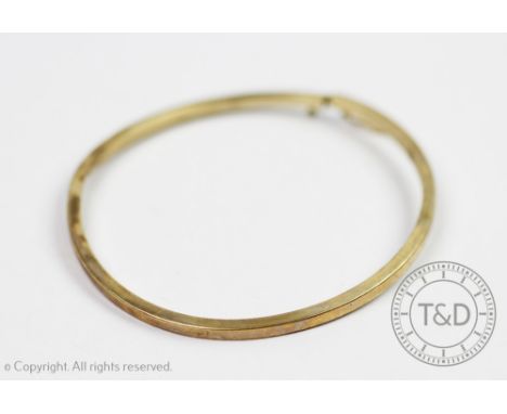 A 9ct yellow gold bangle, of plain square form, integral clasp with single safety catch, gross weight 5.5gms 