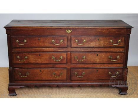 A George III oak and mahogany cross-banded mule chest, with hinged top above two dummy drawers, one long drawer and two short