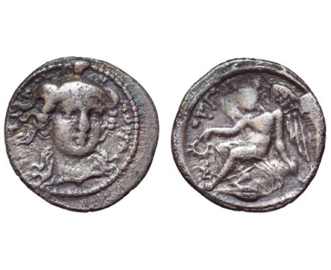 Sicily, Morgantina AR Litra. Circa 339-317 BC. Head of Athena three quarters facing, wearing triple crested helmet / Nike sea