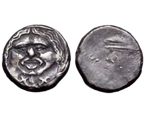 Etruria, Populonia AR 20 Asses. 3rd century BC. Facing head of Metus, tongue protruding, hair bound with diadem, X:X below / 