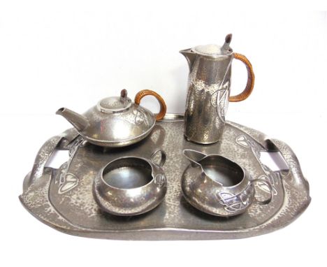 AN ARCHIBALD KNOX FOR LIBERTY &amp; CO. TUDRIC PEWTER FIVE PIECE TEA SERVICE  in the Art Nouveau style, comprising a tea pot,
