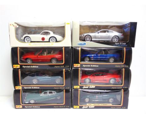 EIGHT 1/18 SCALE DIECAST MODEL CARS  comprising a Welly Jaguar XK Coupe, silver; Signature Models  1949 Jaguar XK120 Racing, 