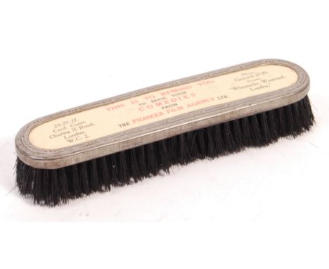 A rare original vintage Pioneer Film Agency Ltd advertising clothes brush. The brush having a metal top, with notation ' This