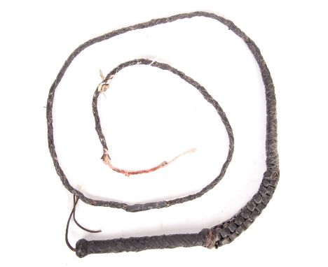 Unknown Production - an original vintage prop leather whip. From the estate of Peter Wyngarde. The whip is of inter-twined le