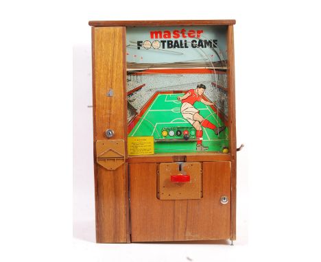 A rare original vintage Mastermatic made ' Master Football Game ' penny arcade slot pinball style machine. Wooden cabinet, wi