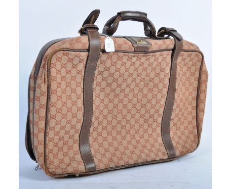 An original vintage 1970's Gucci made overnight / travel suitcase - belonging to Peter Wyngarde. The suitcase with original l