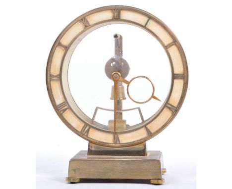 The Estate of Peter Wyngarde - a vintage brass Kieninger &amp; Obergfell electro-magnetic mantle clock. Unusual circular form