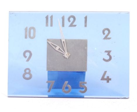 An antique 1930's Art Deco blue glass mantel / table clock. Blue glass construction of square form, with applied metal arabic