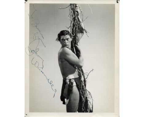 Johnny Weissmuller signed 10x8 inch vintage Tarzan black and white photo. Good condition. All autographs are genuine hand sig