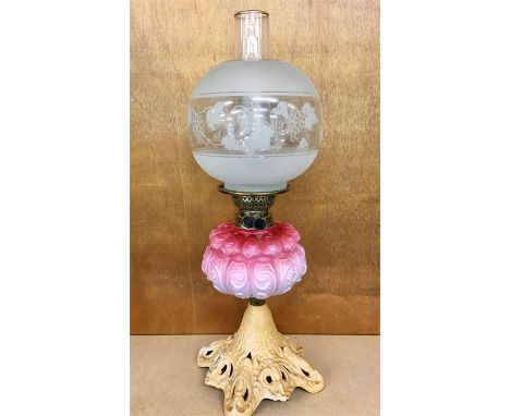 Victorian oil lamp pink glass and iron base 