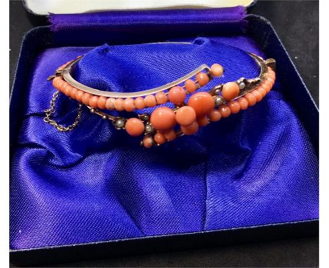 Antique Coral and seed-pearl bangle set in Gold gilt measures approx 67mm by 56mm widest points in good condition 