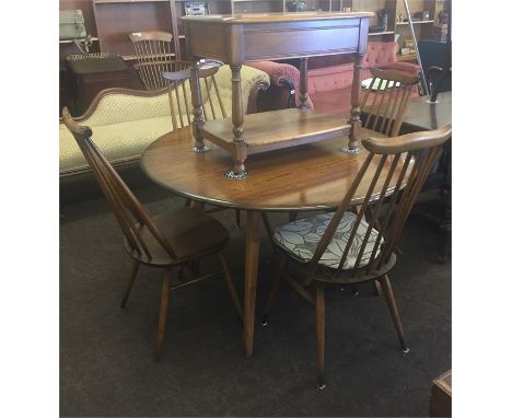 Ercol table and 4 high backed spindel chairs 