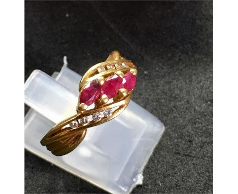 Vintage continental 18ct Gold Ruby and Diamond dress ring set with 3 Rubies and 8 Small Diamonds in continental hallmarked 18