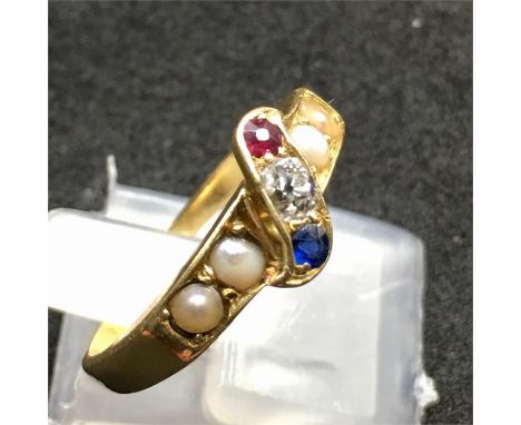 18ct gold Diamond Ruby Sapphire and Seed-pearl ring hallmark worn away tests as 18ct Gold set with central Diamond that measu