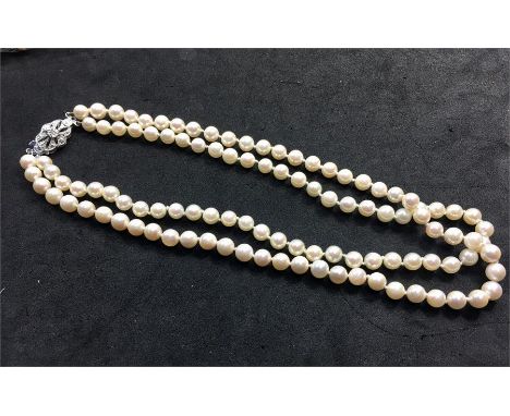Two row uniform cultured Pearl choker necklace each pearl averaging 6mm dia on a hallmarked 9.375 Gold clasp 